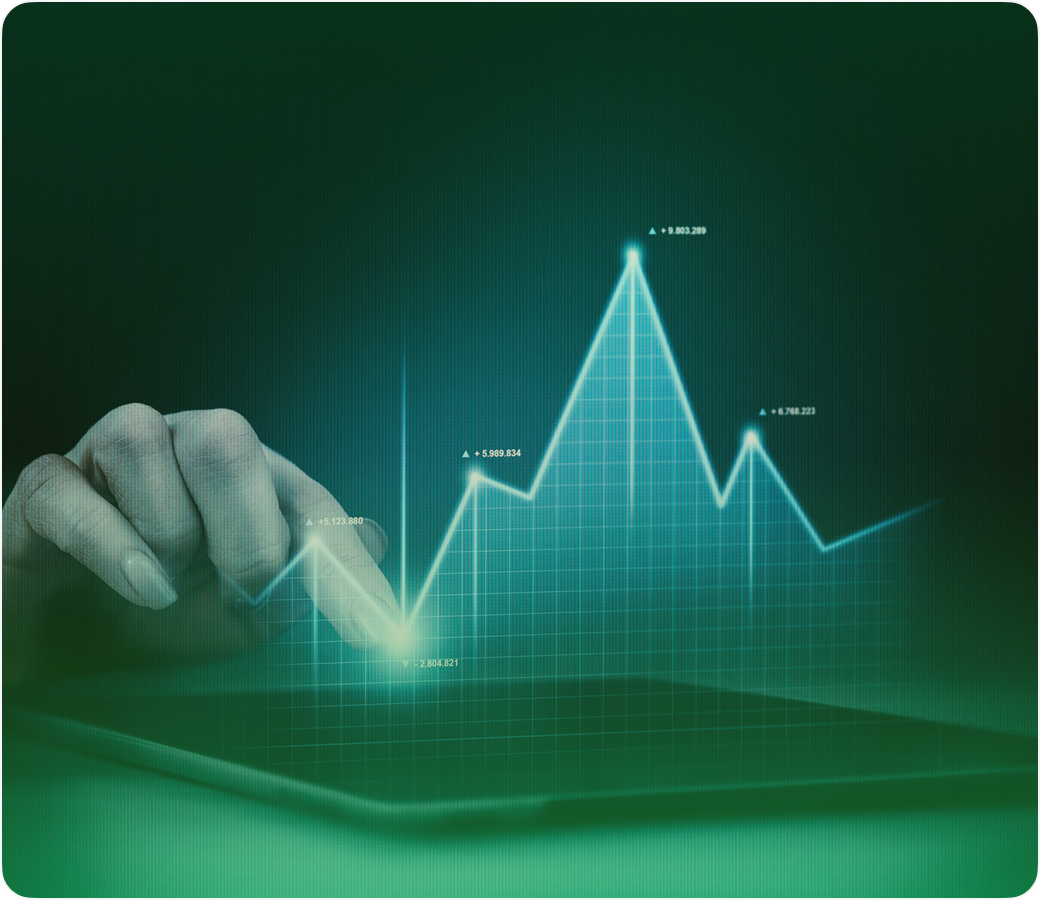 Hand touching a screen with financial chart graphics