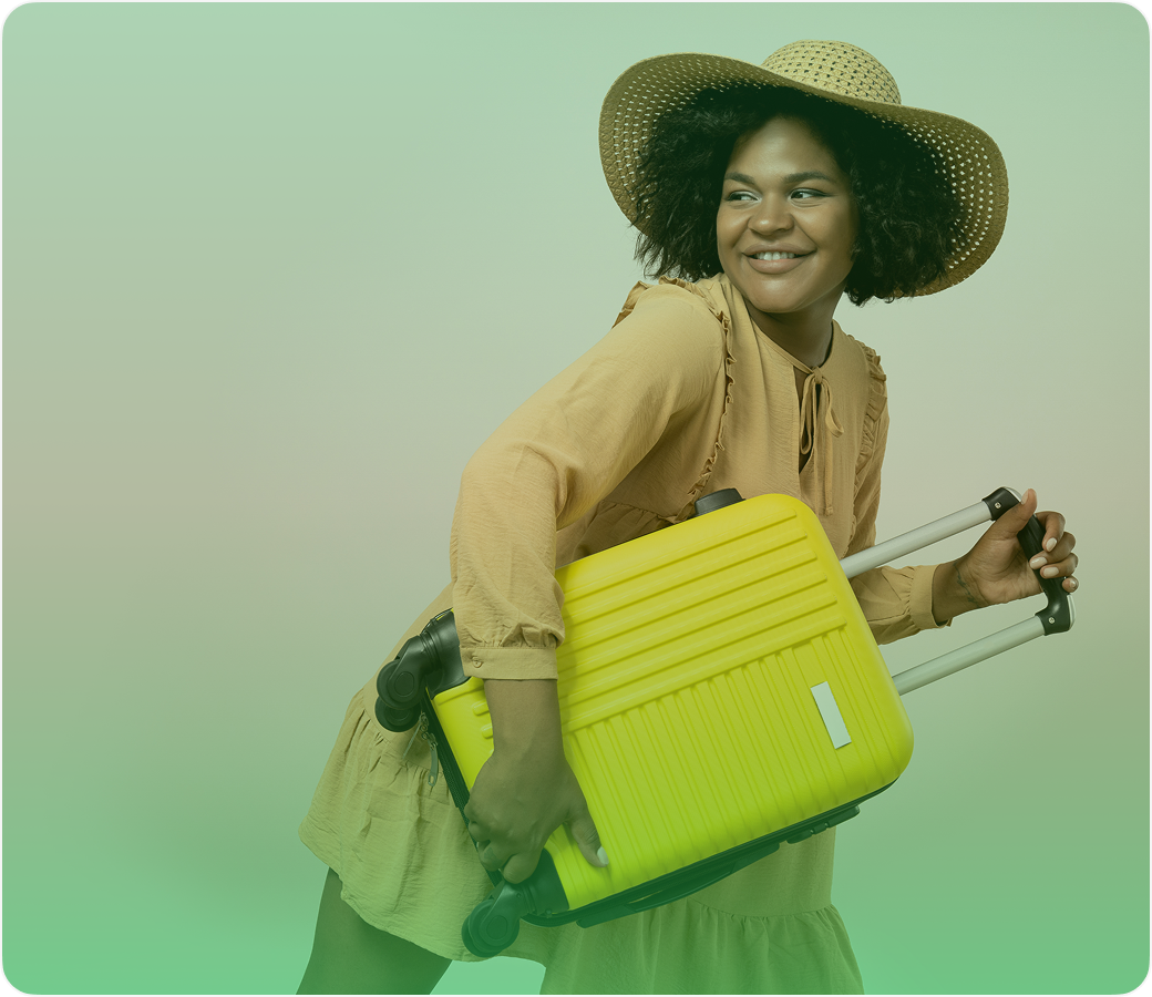 Smiling woman with suitcase in travel outfit