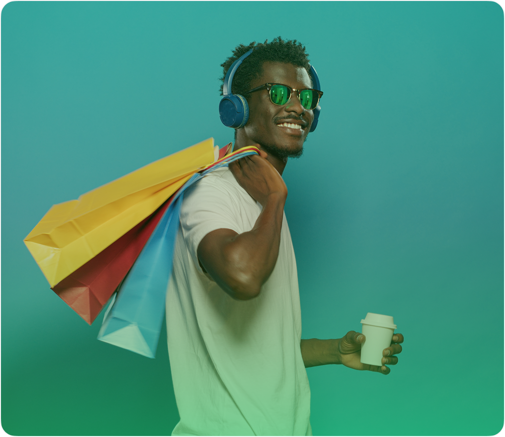Happy shopper with bags and headphones